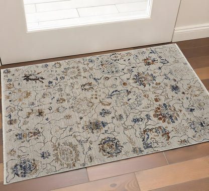 3' X 5' Ivory Blue And Burnt Orange Floral Distressed Area Rug With Fringe