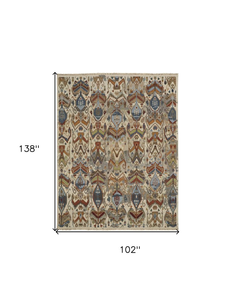 8' X 12' Ivory Blue and Brown Wool Ikat Hand Knotted Area Rug With Fringe
