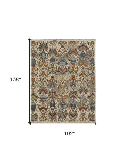 8' X 12' Ivory Blue and Brown Wool Ikat Hand Knotted Area Rug With Fringe