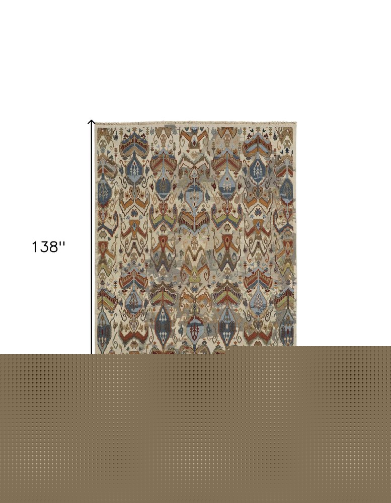 8' X 12' Ivory Blue and Brown Wool Ikat Hand Knotted Area Rug With Fringe