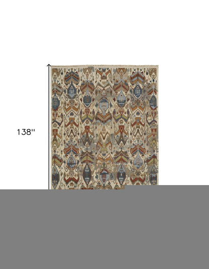 8' X 12' Ivory Blue and Brown Wool Ikat Hand Knotted Area Rug With Fringe