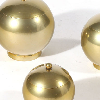 Set of Three Gold Metal Decorative Lidded Canisters