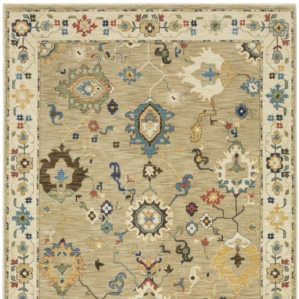 8' X 11' Beige Light Blue And Tan Oriental Area Rug With Fringe