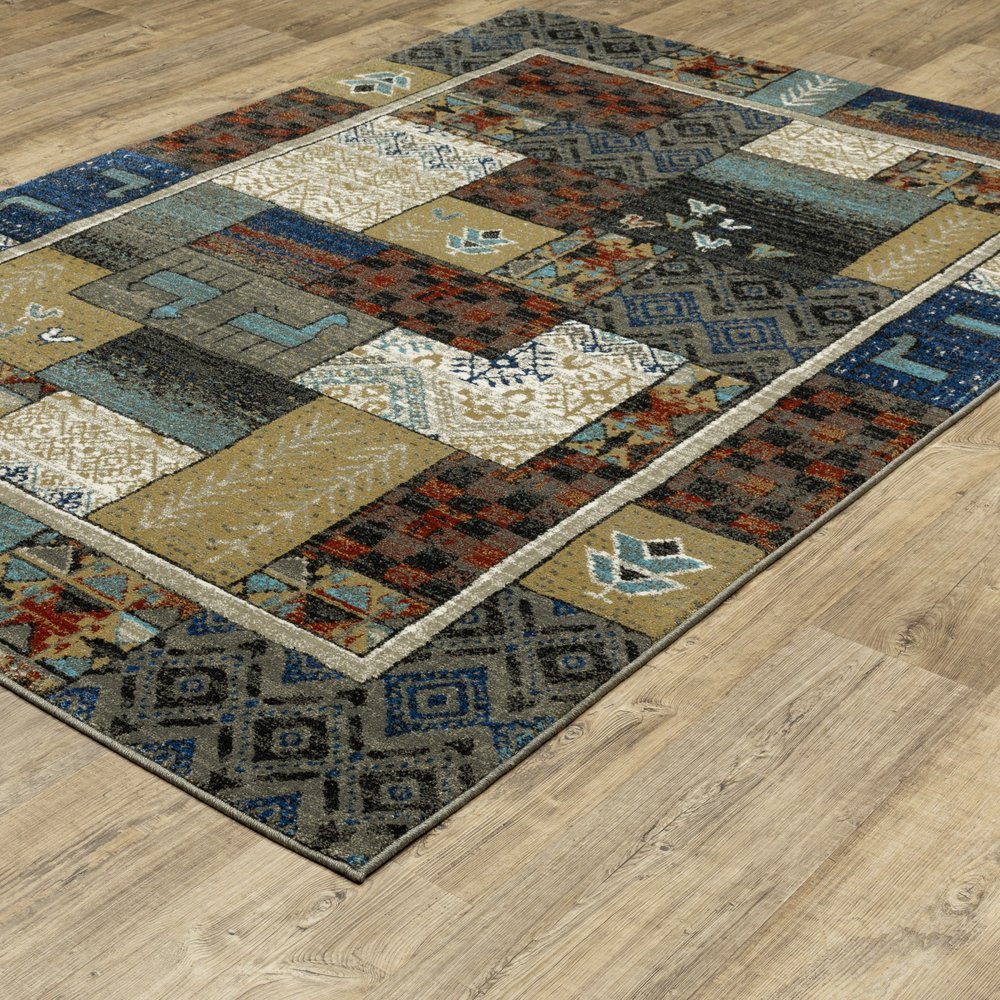 8' X 10' Brown Tan And Blue Patchwork Area Rug