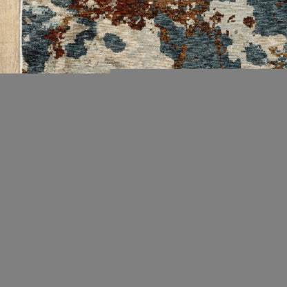 8' X 11' Beige Rust And Teal Abstract Distressed Area Rug With Fringe