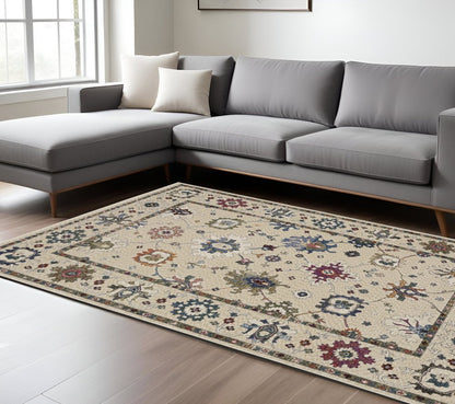 8' X 11' Ivory Blue And Light Brown Floral Area Rug With Fringe