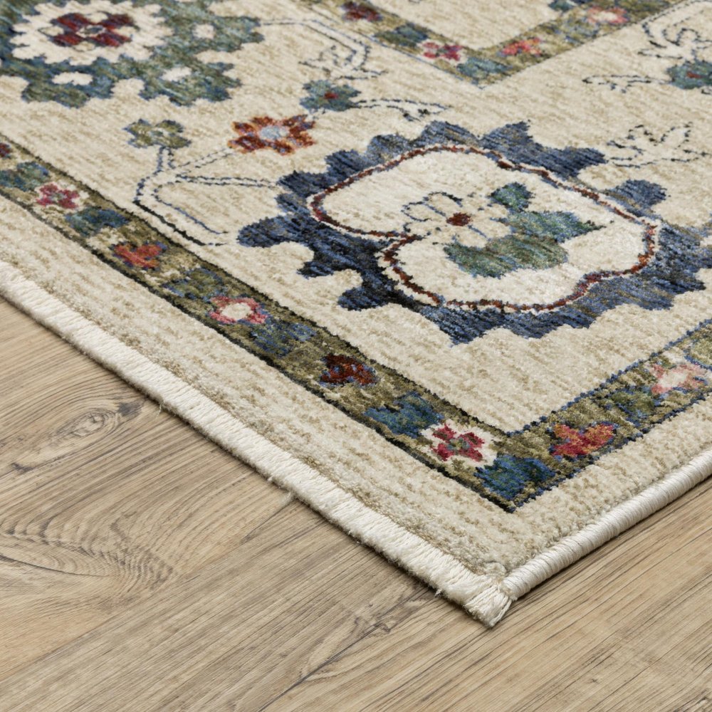 8' X 11' Ivory Blue And Light Brown Floral Area Rug With Fringe