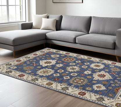 8' X 11' Blue And Ivory Floral Area Rug With Fringe