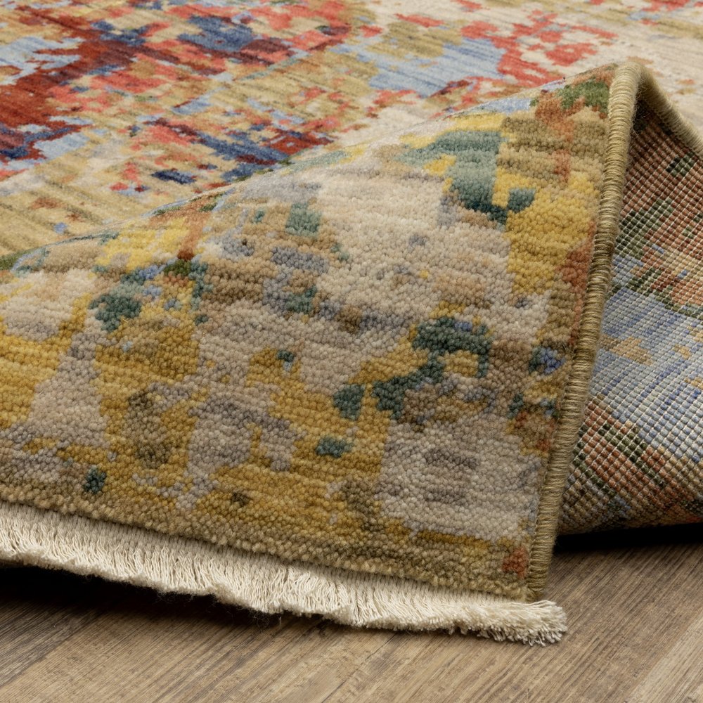 8' X 11' Beige Salmon And Tan Abstract Area Rug With Fringe