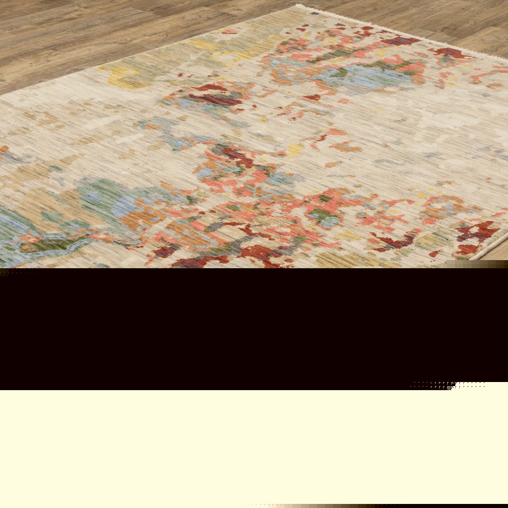 8' X 11' Beige Salmon And Tan Abstract Area Rug With Fringe